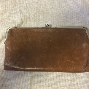 Hobo wallet. Has dust bag. Has a little bit of wear (in pics)